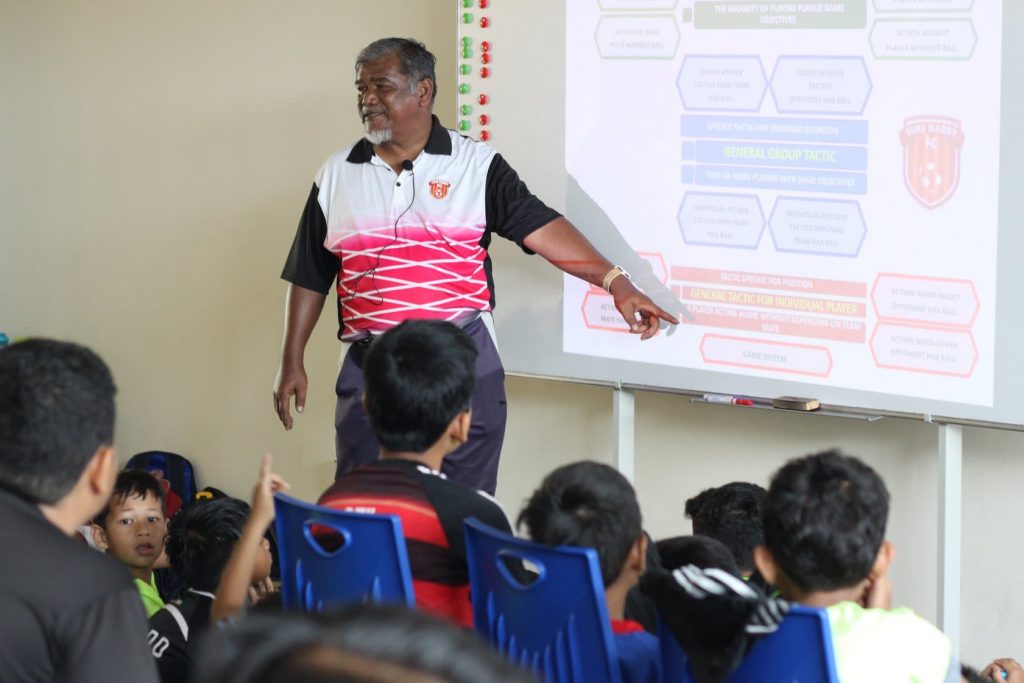 coach-teaching-kids-slides-op